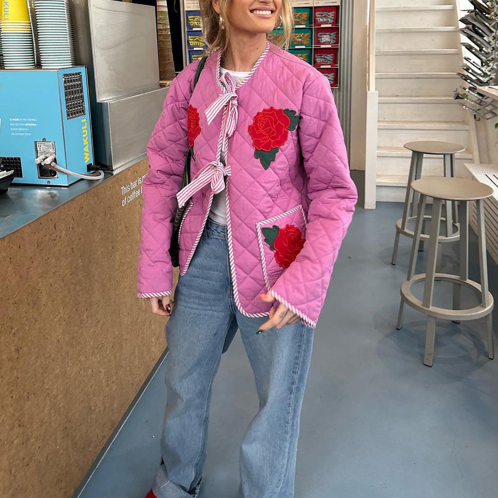 Veste fine rose à imprimé rose et nœud