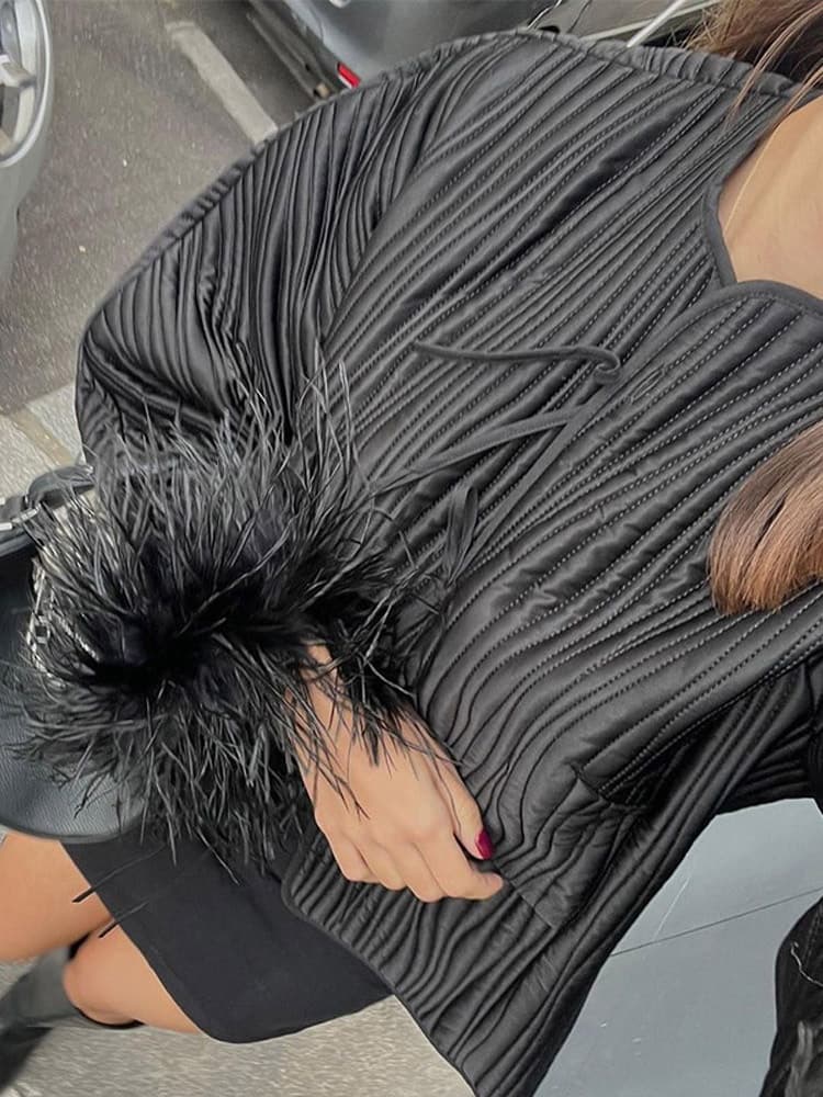 Veste à détails en plumes